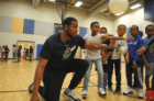 To keep the game fair, ODU basketball player Brandan Stith keeps the boys from blocking the girls’ shots during a Bear Pong game. Photo Chuck Thomas/ODU